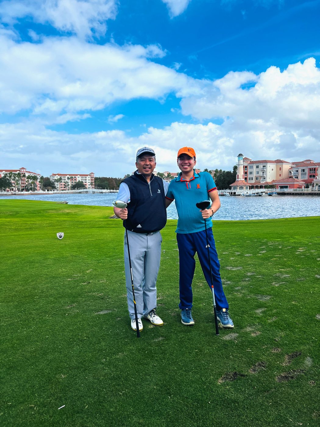Renato Cruz Sogueco on a golf course tee box with drivers in hand